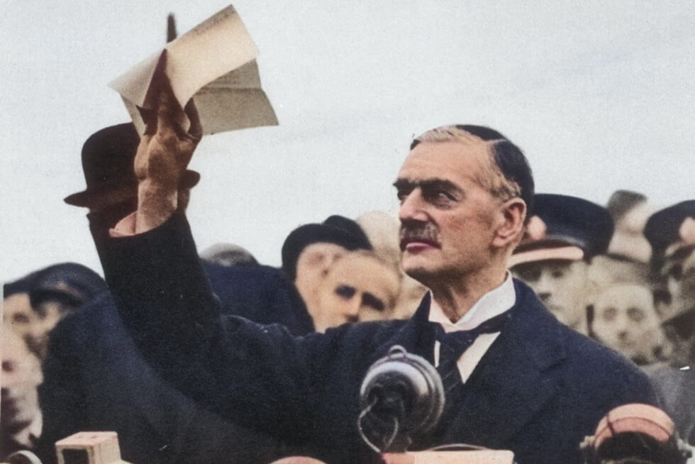 British Prime Minister Neville Chamberlain declaring "peace in our time.